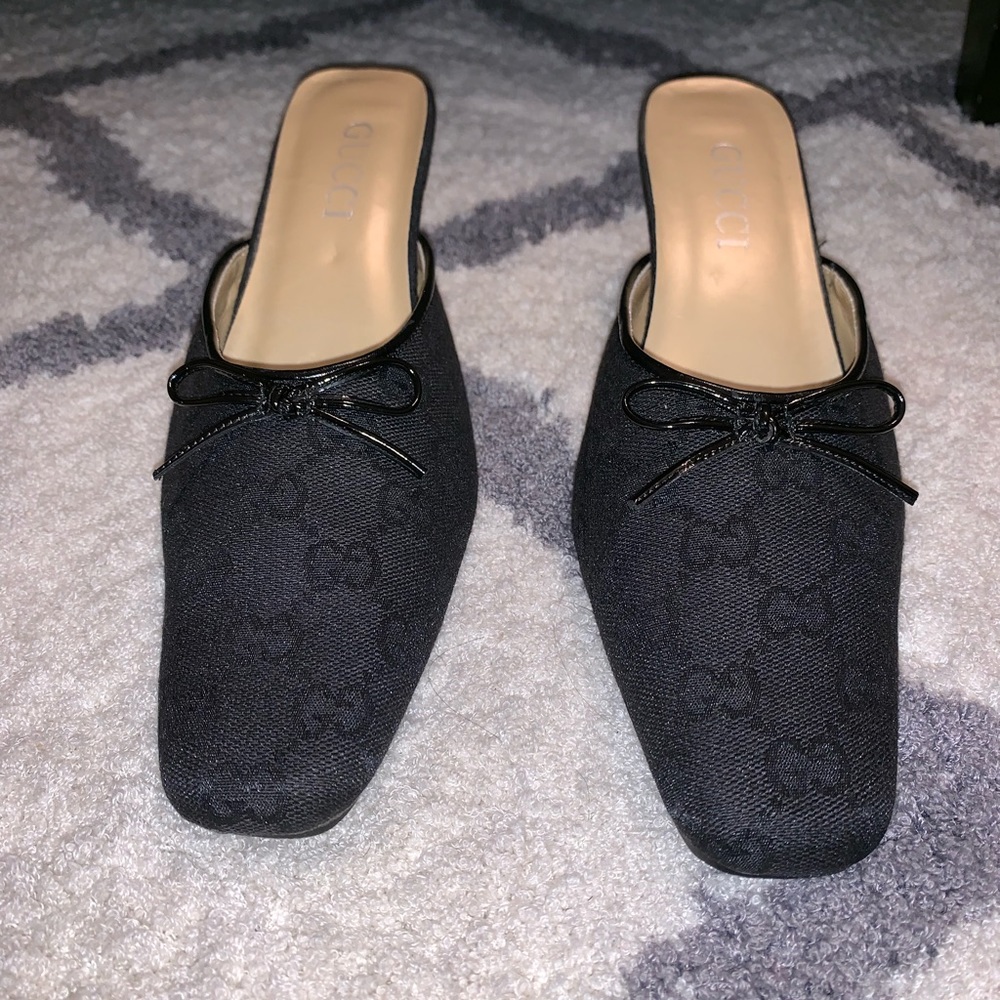 Black Gucci monogrammed nylon slip on heels.